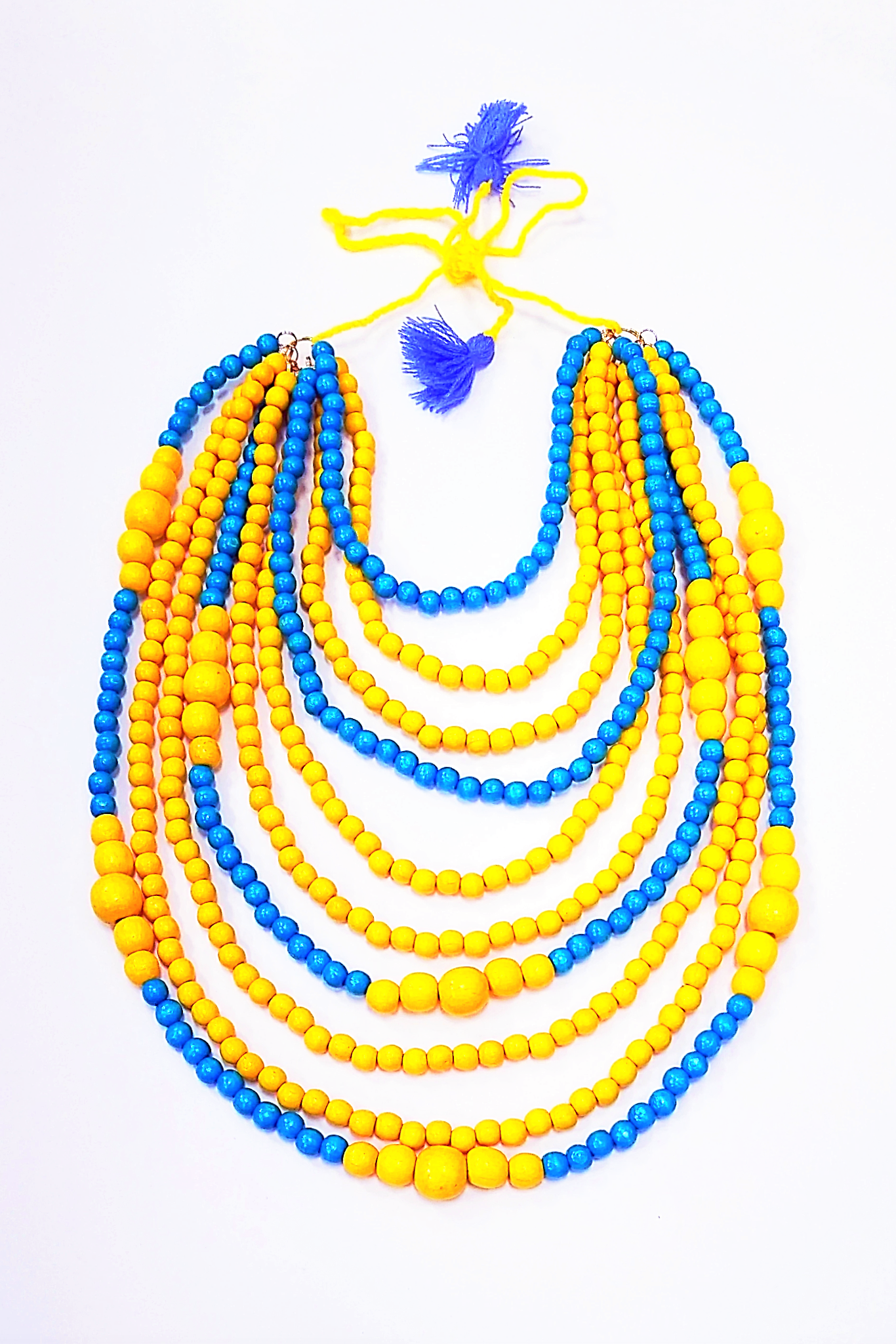 Artisan crafted wooden bead 10-strand necklace. Yellow and blue