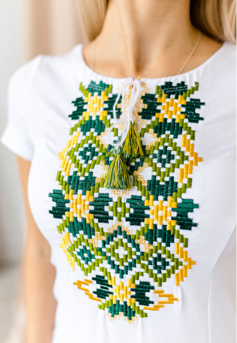 Women's short sleeve white shirt with cross-stitch embroidery. Green